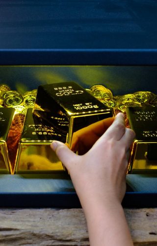 Hand open electronics steel safe box full of coins stack and gold bar